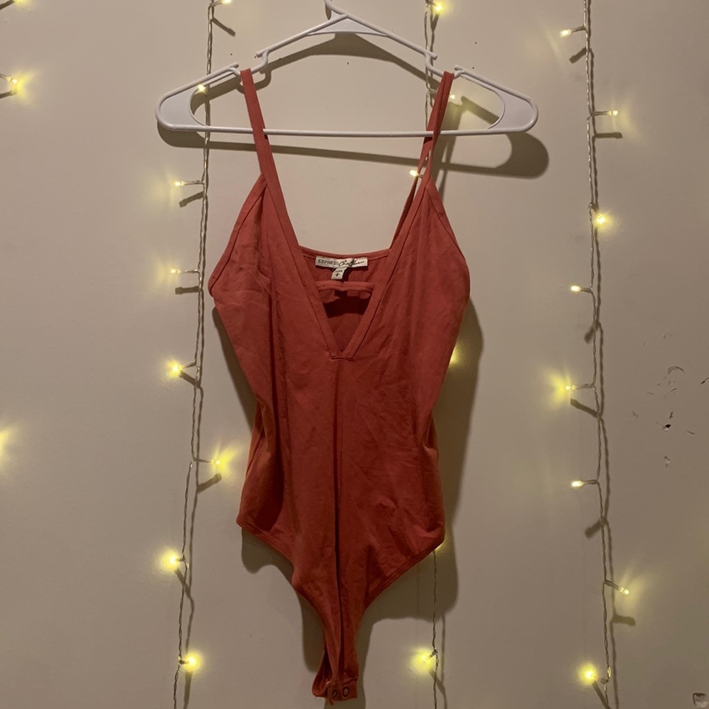 Express small v neck body suit with thong bottom.